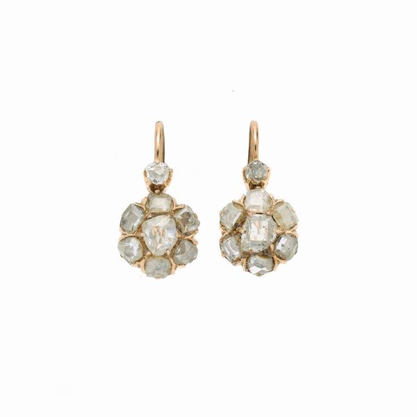 Pair of a fish hook earrings in yellow gold and diamonds