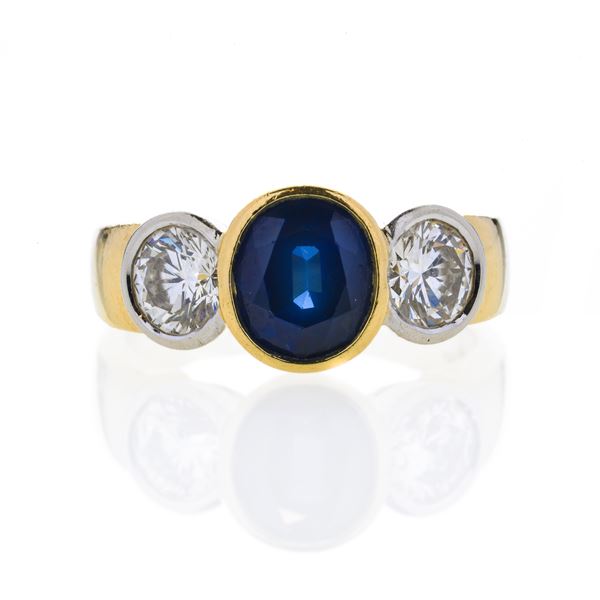 Ring in yellow gold, diamonds and sapphire