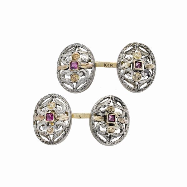 Pair of cufflinks in yellow gold, silver and red stones