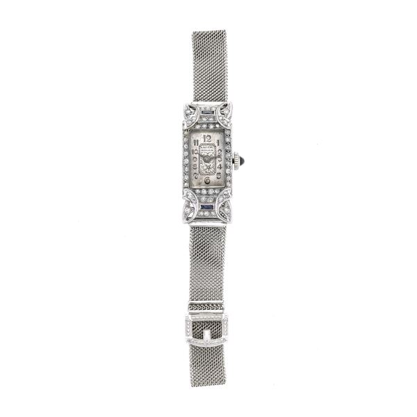 Lady's watch in platinum, 14 kt gold, diamonds and Rolex sapphires
