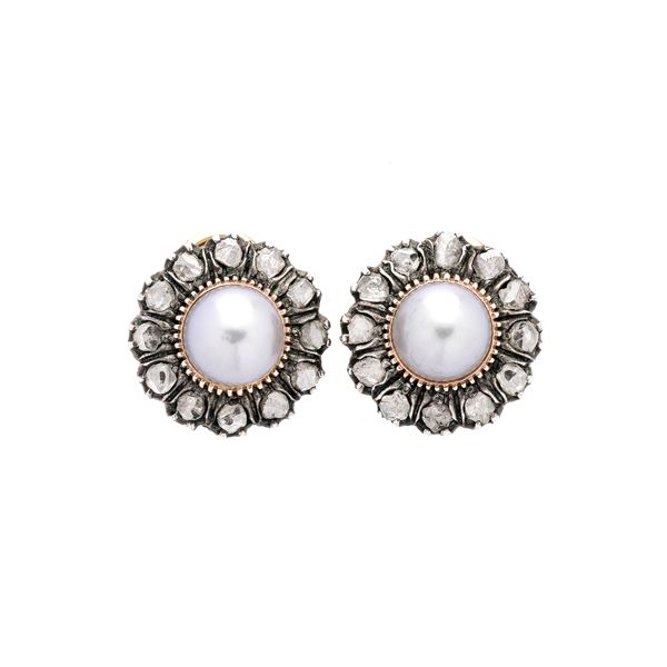 Pair of clip earrings in yellow gold, silver, diamonds and cultured pearl