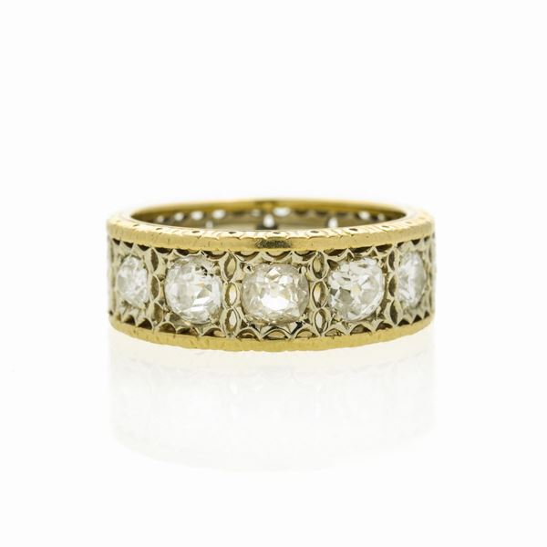 Anello a fascia in oro giallo, oro bianco e diamanti