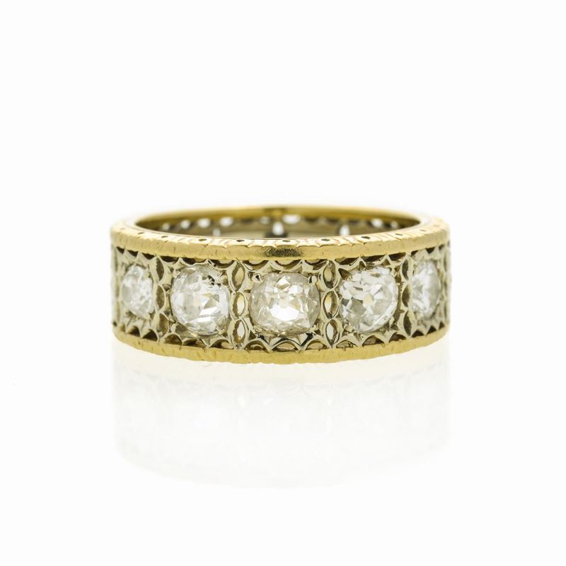 Anello a fascia in oro giallo, oro bianco e diamanti