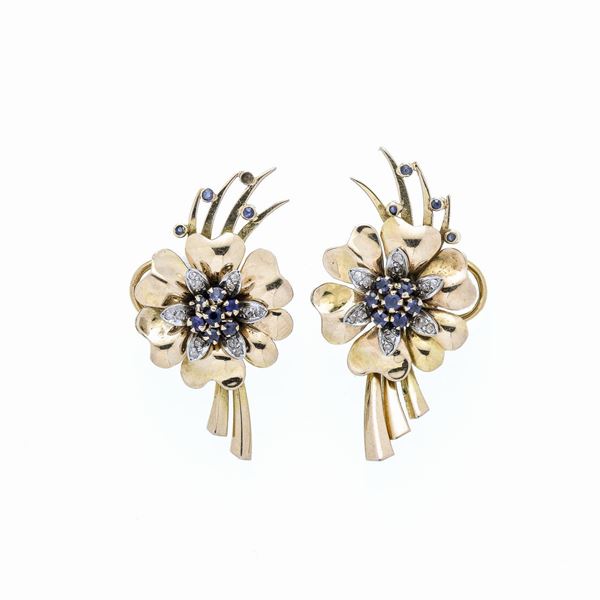 Pair of clip-on earrings in yellow gold, white gold, diamonds and sapphires