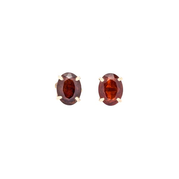 Pair of yellow gold and garnet clip-on earrings