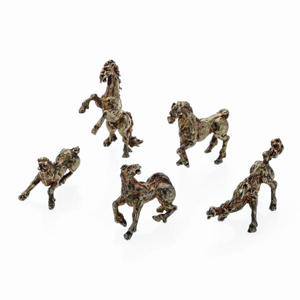 Series of five horses in gilded silver