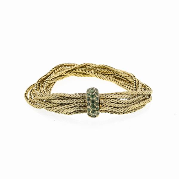 Bracelet in yellow gold and emeralds