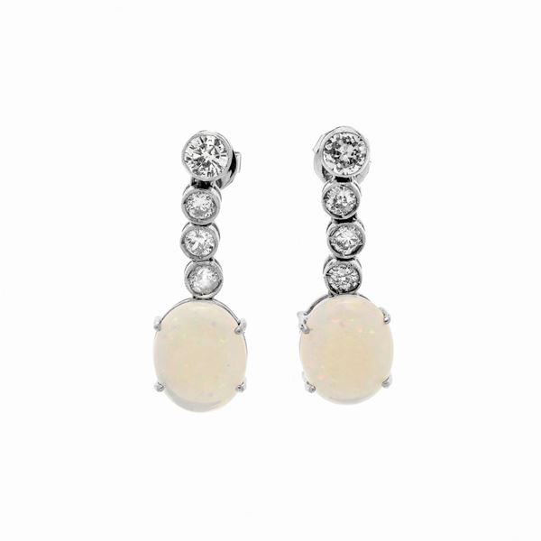 Pair of dangling earrings in white gold, diamonds and opal