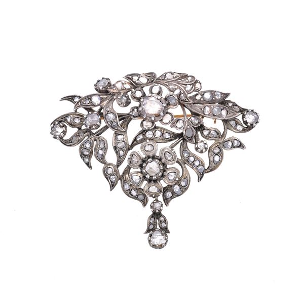 Large brooch in low-titled gold, silver and diamonds