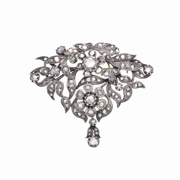 Large brooch in low-titled gold, silver and diamonds