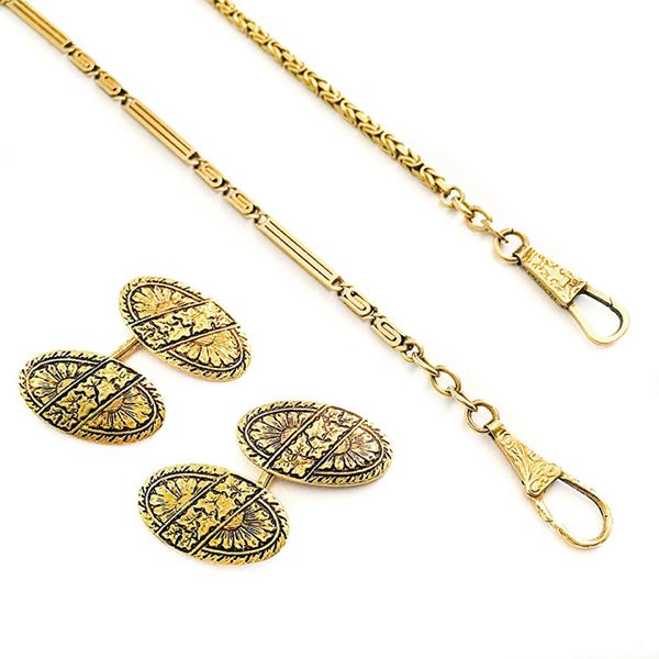 Two watch chains and a pair of cufflinks in yellow gold