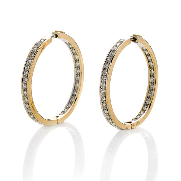 Pair of hoops in yellow gold, white gold and diamonds