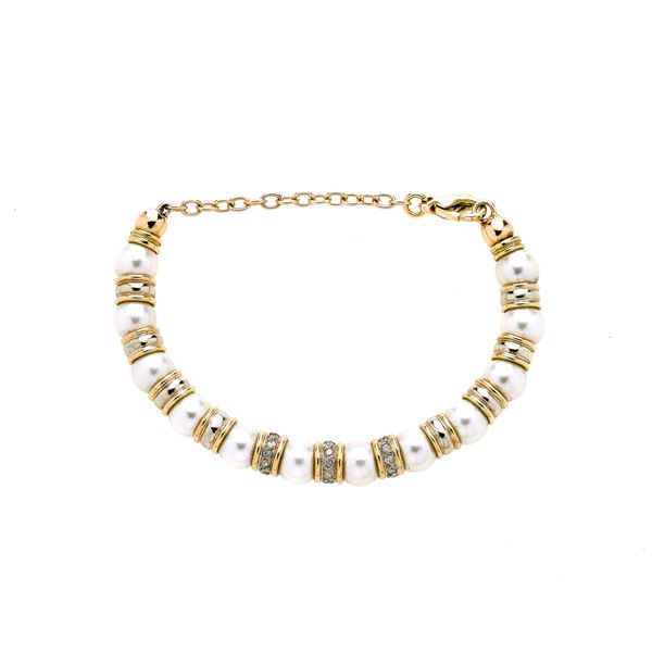 Semi-rigid bracelet in yellow gold, diamonds and cultivated pearls