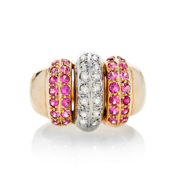 Ring in rose gold, white gold, diamonds and red stones