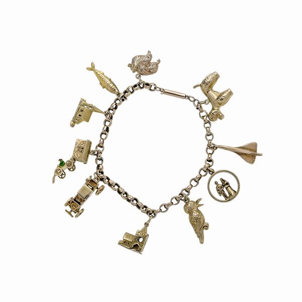 Bracelet in low-title gold with charms  - Auction Jewelery auction, Gemstones and Wristwatches from a Veronese Collection - Curio - Casa d'aste in Firenze