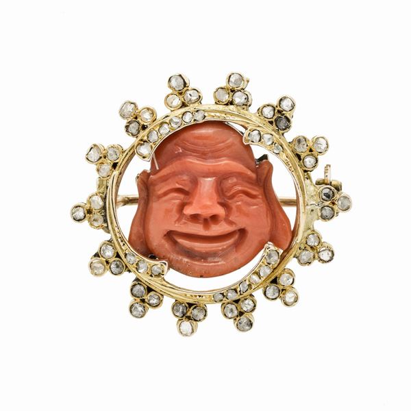 Brooch with gold low title, diamonds and red coral engraved