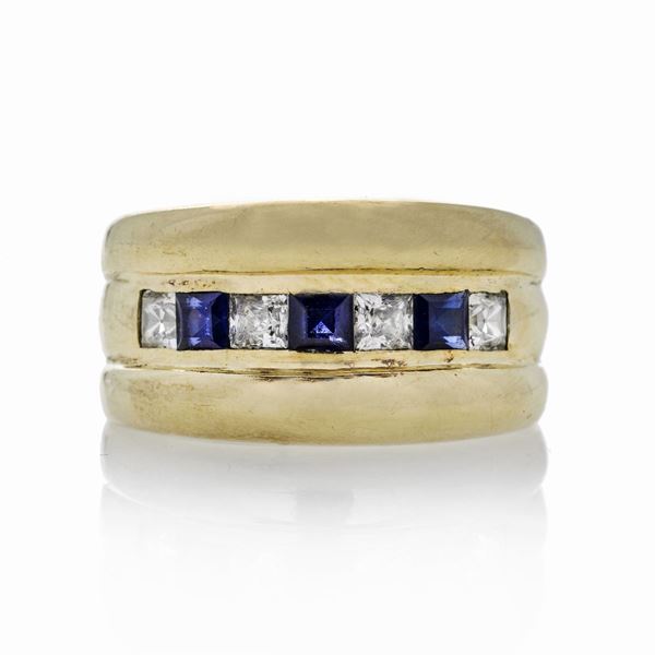 Anello a fascia in oro giallo, diamanti e zaffiri