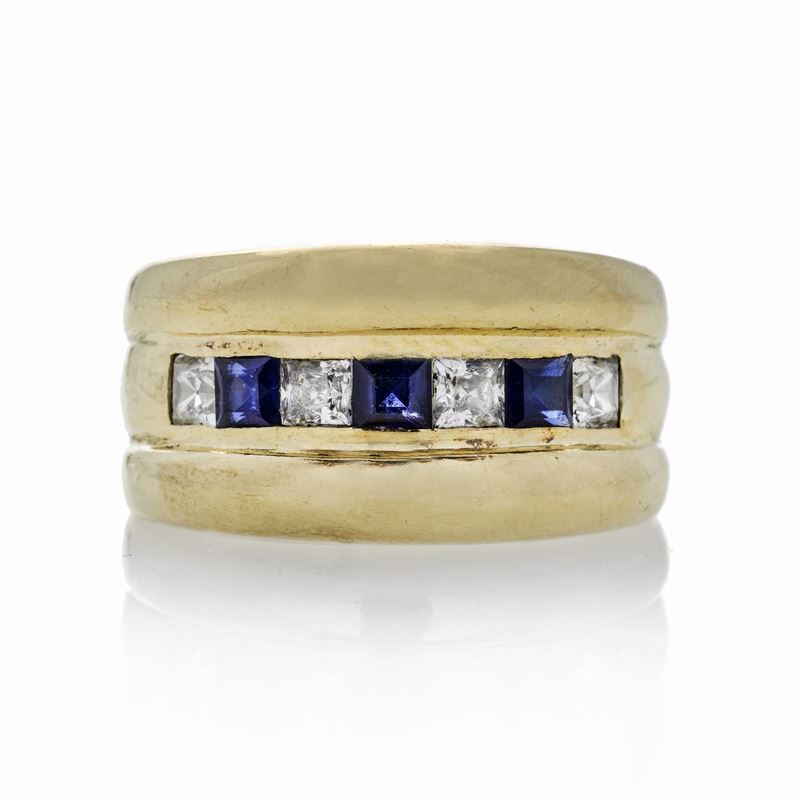 Anello a fascia in oro giallo, diamanti e zaffiri