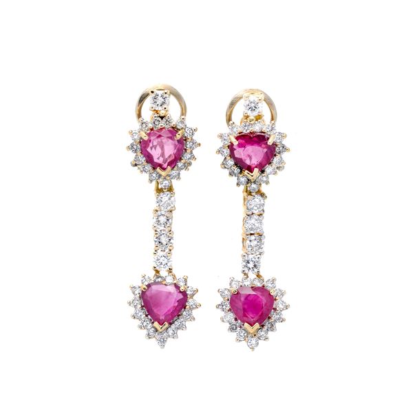 Pair of dangling earrings in yellow gold, diamonds and rubies