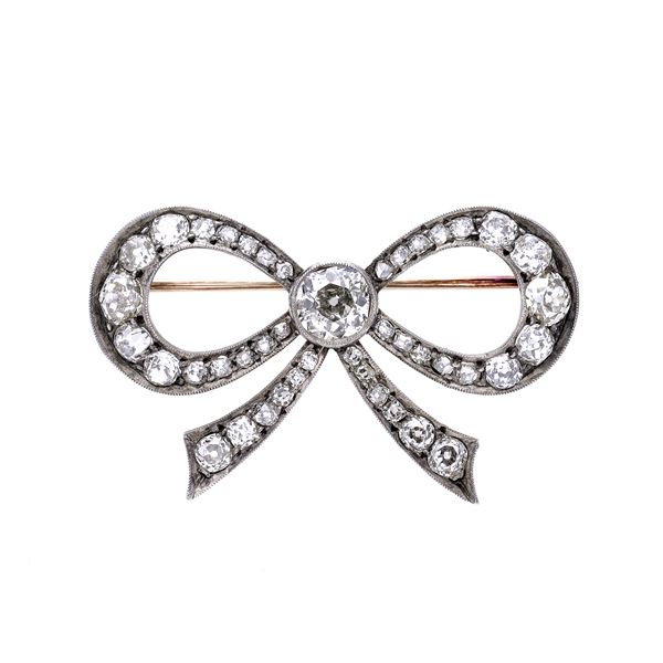 Bow brooch in low title gold, silver and diamonds