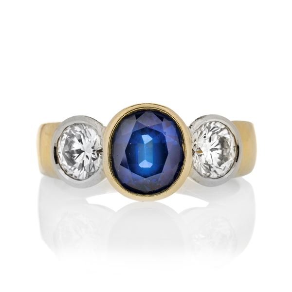 Ring in yellow gold, diamonds and sapphire