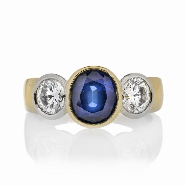 Ring in yellow gold, diamonds and sapphire