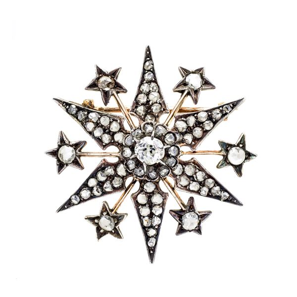 Star brooch in low title gold, silver and diamonds