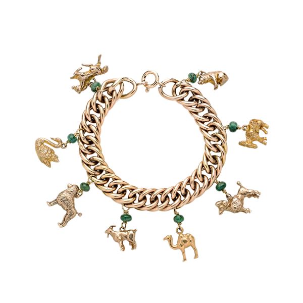 Bracelet with charms in 14 kt gold and emeralds