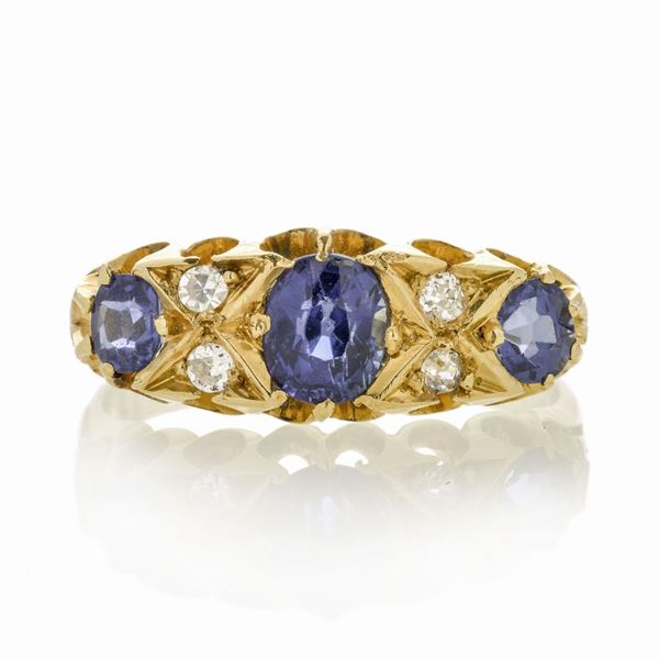 Ring in yellow gold, diamonds and sapphires
