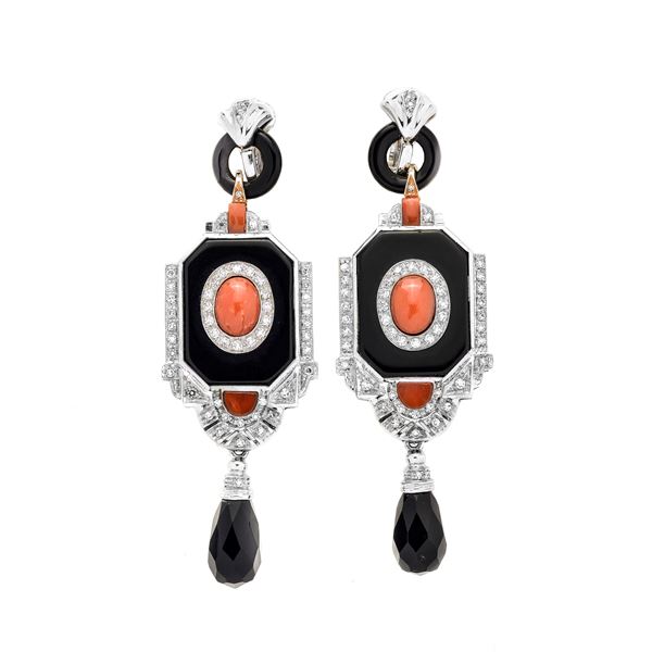Pair of dangling earrings in white gold, diamonds, onyx and red coral