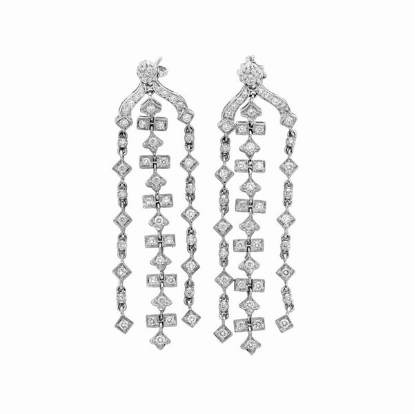 Pair of dangling earrings in white gold and diamonds