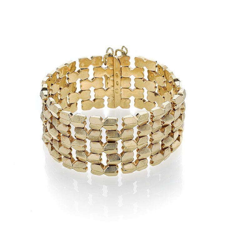 Alto bracciale in oro giallo a maglie intrecciate