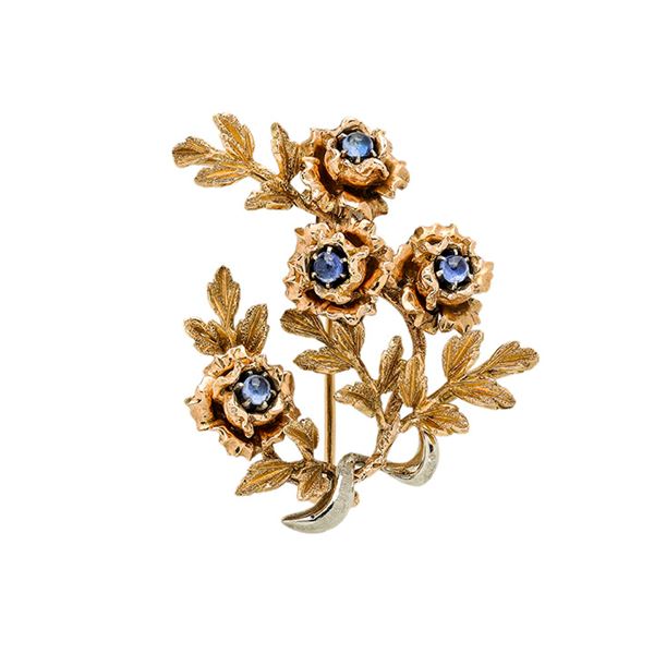 Floral brooch in yellow gold and sapphires