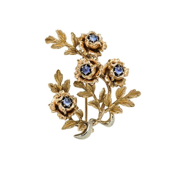 Floral brooch in yellow gold and sapphires