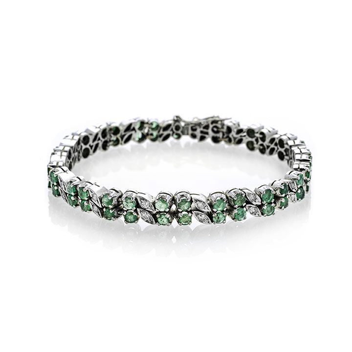 Bracciale in oro bianco, diamanti e smeraldi