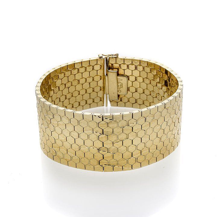 Alto bracciale in oro giallo inciso