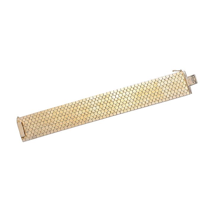 Alto bracciale in oro giallo inciso