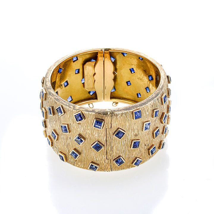 Grande bracciale rigido in oro giallo e zaffiri