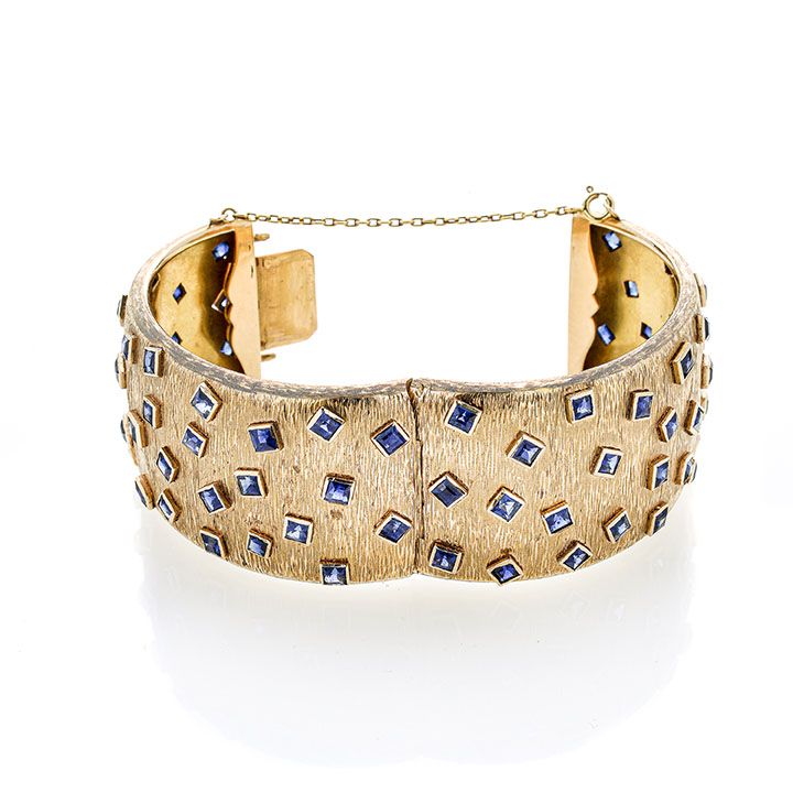 Grande bracciale rigido in oro giallo e zaffiri