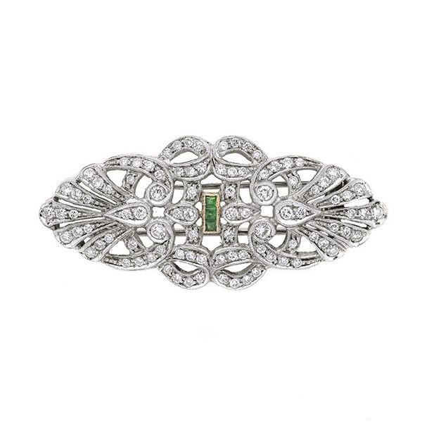 Clips in platinum, yellow gold and emeralds