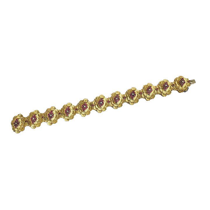 Bracciale in oro giallo, rubini e diamanti