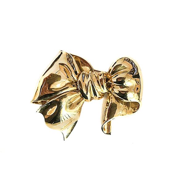 Bow large clip in yellow gold