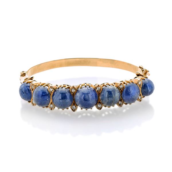 Large rigid bracelet in yellow gold, diamonds and sapphire root