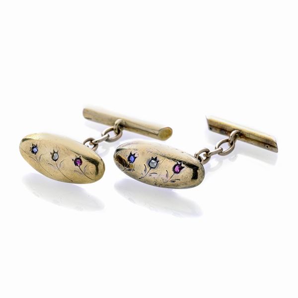Pair of cufflinks in low title gold, rubies, diamonds and sapphires