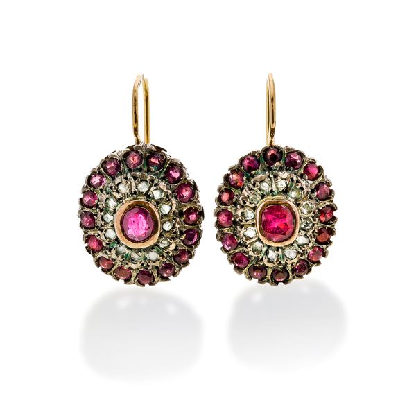 Pair of leverback earrings in yellow gold, silver, diamonds and rubies