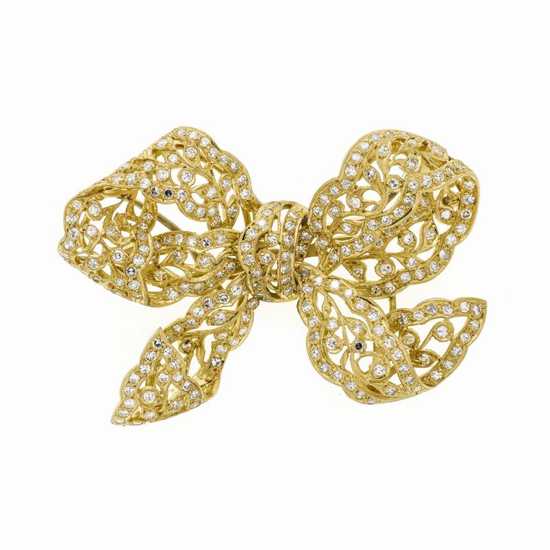 Spilla fiocco in oro giallo e diamanti