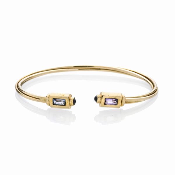 Rigid bracelet in yellow gold and colored quartz