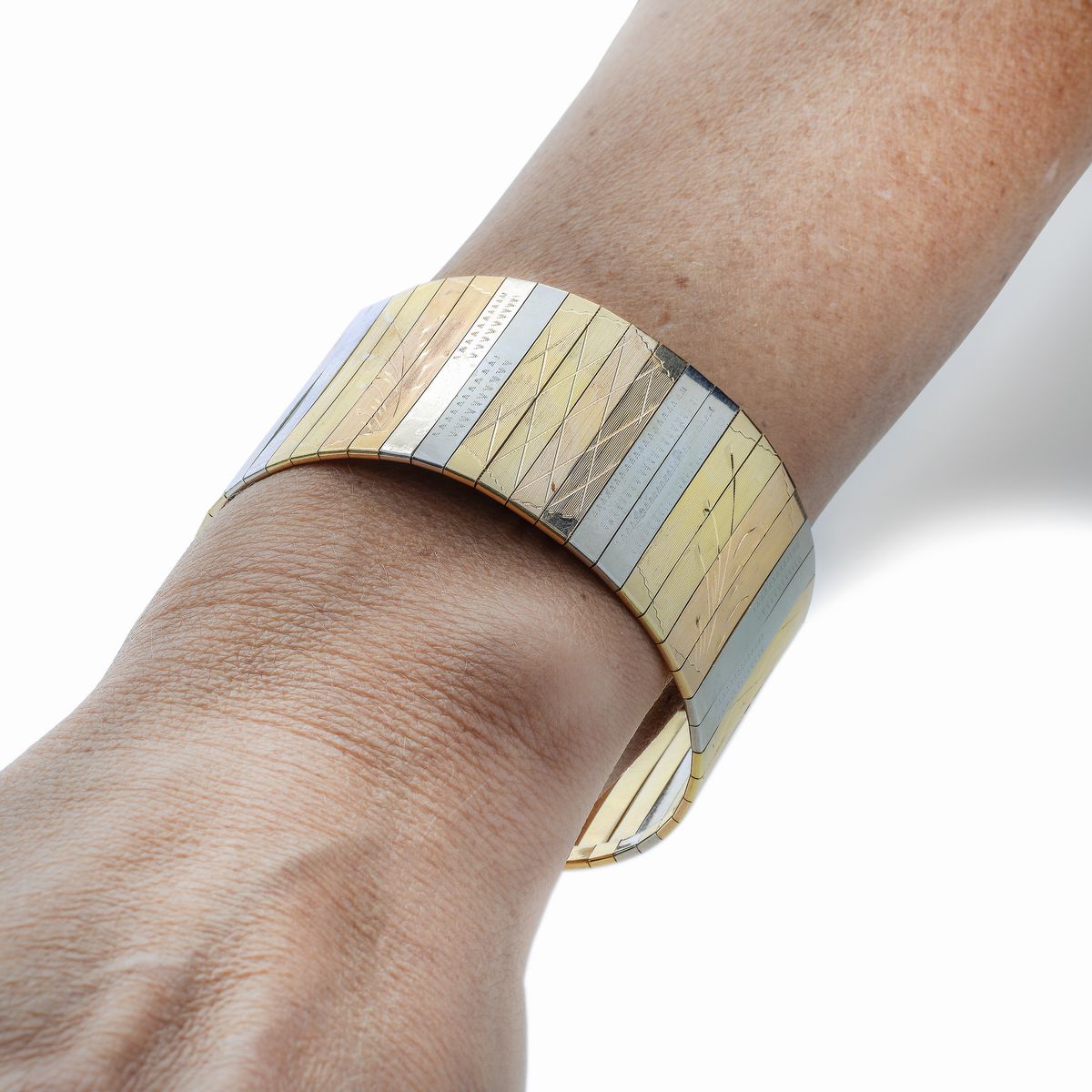 Alto bracciale in oro giallo, oro bianco e oro rosa