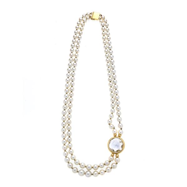 Two-strand necklace of cultured pearls, yellow gold and rock crystal