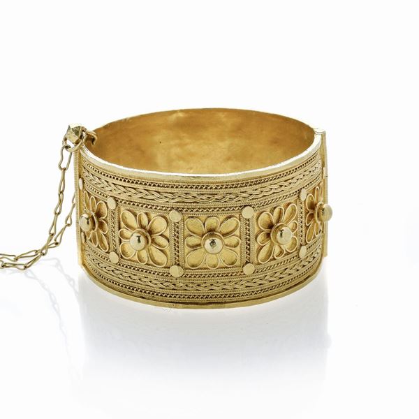Alto bracciale in oro giallo